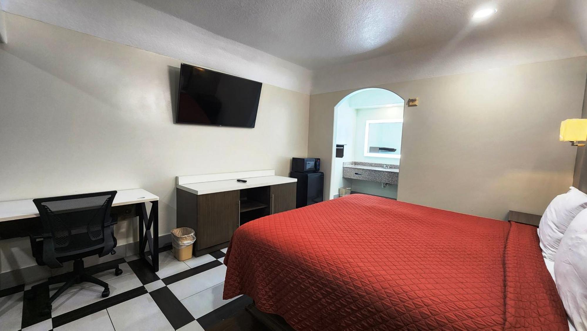 Scottish Inn & Suites Sam Houston Parkway Dış mekan fotoğraf